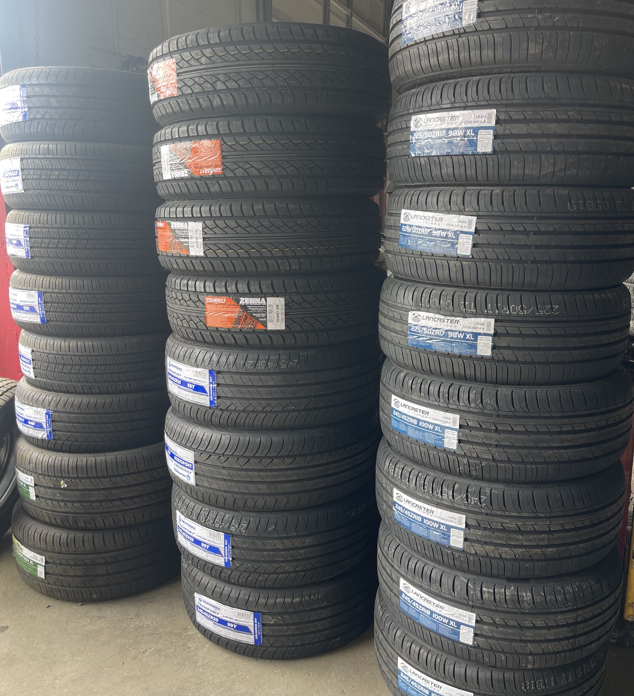 Rows of new tires stacked floor to ceiling