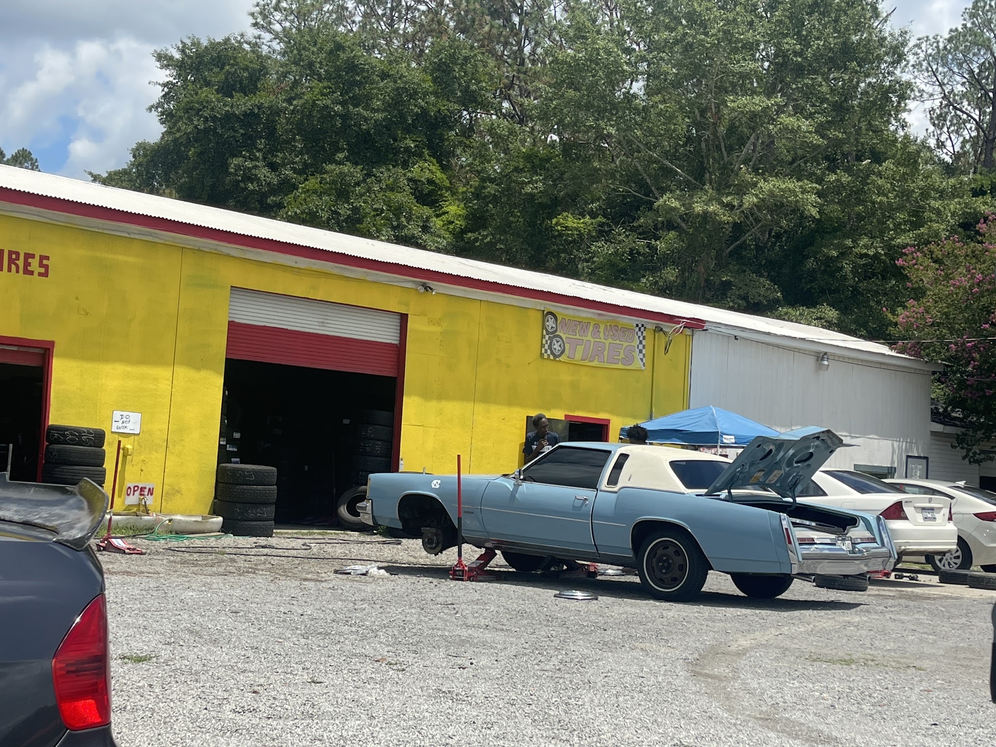 The yellow shop front on Pamplico Hwy with a car in the lot